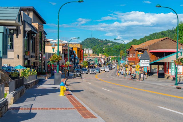 Downtown Gatlinburg Tennessee main street with shops restaurants and Great Smoky Mountains backdrop